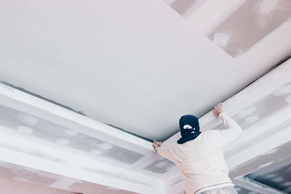 Gypsum false ceiling with recessed lights in a Karachi home