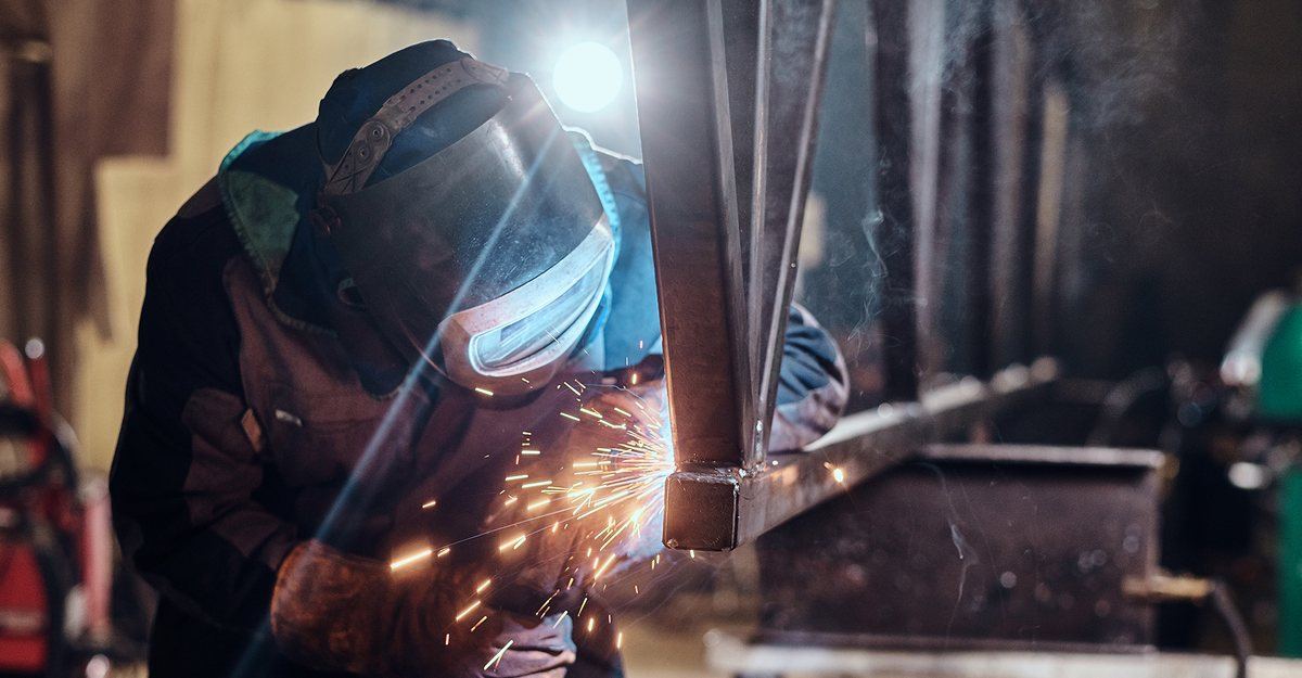 Steel fabrication in Karachi — welding work on a custom metal gate frame